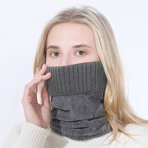 Detailed close-up of dark grey ribbed knit texture on a warm winter neck warmer