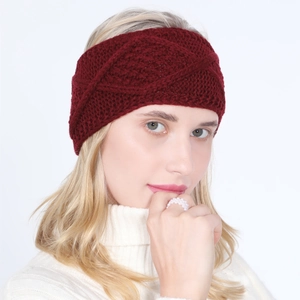 Detail of wine red chunky knit headband with criss-cross pattern for winter warmth