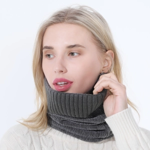 Detail of dark grey ribbed knit neck warmer showing thick woolen texture and warm lining