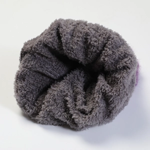 Detail of the soft grey fleece lining inside the knitted beanie for winter warmth