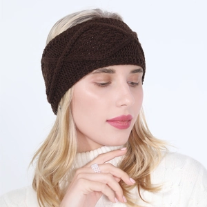 Close-up of brown knit headband with twist knot design for women in winter