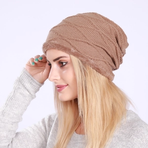 Detail of warm camel knit beanie featuring diamond texture and thick plush faux fur lining
