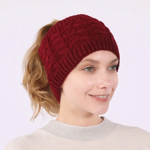 Macro shot of the wine red cable knit ponytail headband with stretch material