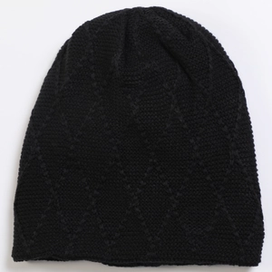 Detailed close-up of black knitted beanie showing diamond pattern texture and thick fabric