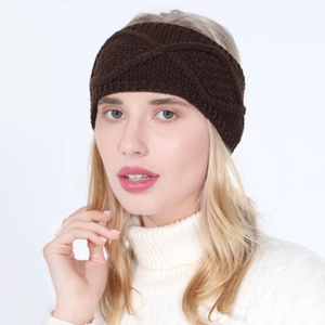 Detail of dark brown knit headband with classic cable pattern and central twist knot design