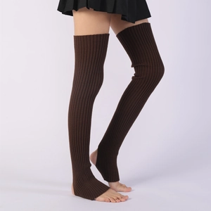 Close-up of dark brown ribbed knit leg warmers with stirrup heel for yoga and ballet
