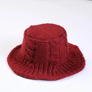 Close-up of deep red twisted knit texture on thick winter bucket hat for women