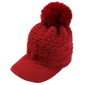 Women's red winter knit peaked hat with warm lining and large fluffy faux fur pom-pom