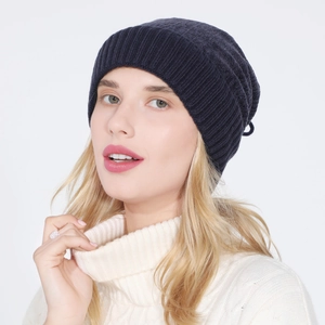 Detail of navy knit beanie with vertical ribbed texture and warm fleece lining