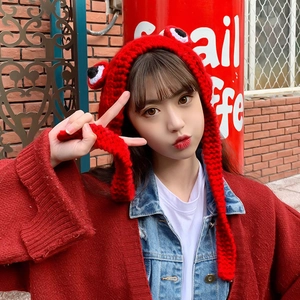 Red knit frog hat with 3D eyes and long ear flaps for winter warmth and cute style