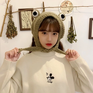 Handmade knitted frog-shaped winter hat with cute eyes and warm ear protection flaps