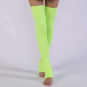 Detail of neon green ribbed knit leg warmers showing elastic texture and stirrup design