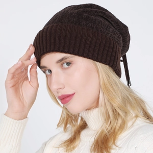 Detailed texture of dark brown knit beanie with soft fleece lining for winter warmth