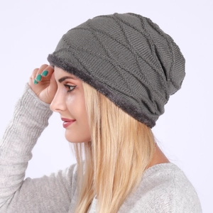 Detail of the thick grey fleece lining inside the knitted pleated beanie hat