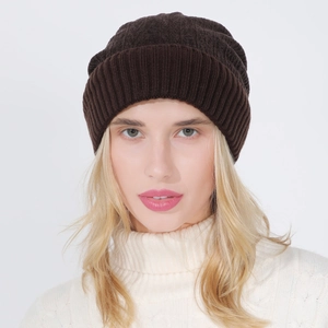 Close-up of deep brown ribbed knit beanie hat showing thick warm texture for winter