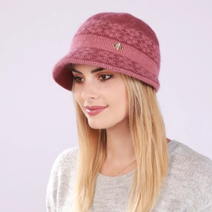 Detail of rose red knit winter hat featuring a luxury gold insect pin with crystals