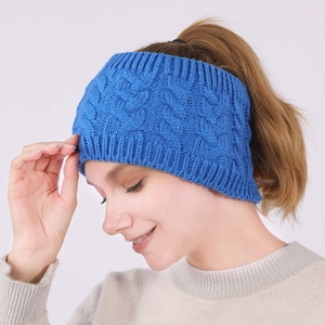 Detail of blue cable knit headband showing texture and ponytail compatibility