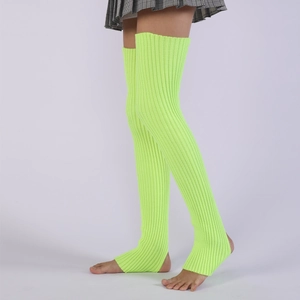 Close-up of neon green ribbed knit leg warmers showing over-the-knee length and texture