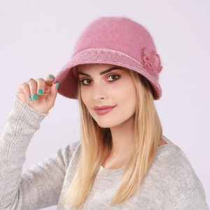 Close-up of pink rabbit fur knit bucket hat with warm plush lining and flower detail