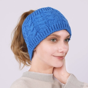 Detail of blue cable knit ponytail headband showing texture and ribbed edges for women