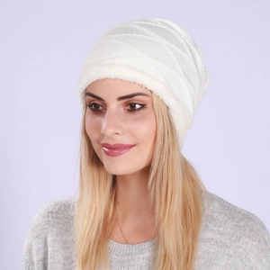 Detail of white knit beanie showing warm plush lining and diagonal wave pattern