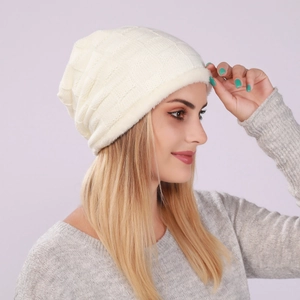 Close-up of off-white waffle-knit beanie with thick fleece lining for winter warmth