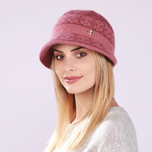 Detail of warm pink knit bucket hat featuring a gold bow accent and thick fleece texture