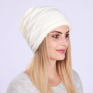 Detail view of white chunky knit beanie with warm plush faux fur lining for winter