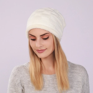 Close-up of cream white knitted beanie with checkered texture and thick fleece lining