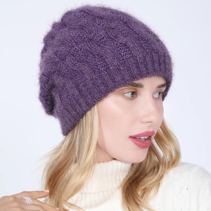 Women's purple cable knit beanie with gold silk and warm fleece lining on model