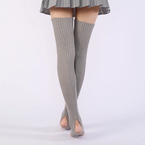 Close-up of gray ribbed knit stirrup leg warmers with elastic over-the-knee design