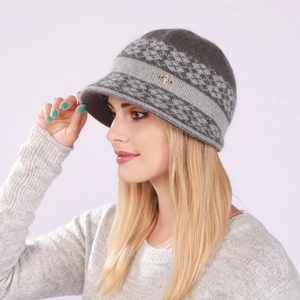 Detail of warm grey knit hat with floral jacquard pattern and golden bee pin decor