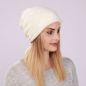 Detail view of cream white knit beanie with square grid pattern and thick fleece lining