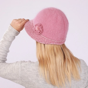 Detailed back view of pink rabbit fur knit bucket hat with warm plush lining and flower
