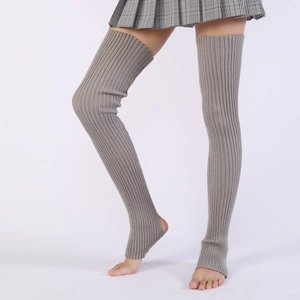 Close-up of grey ribbed knit thigh-high leg warmers with stirrup heels for yoga