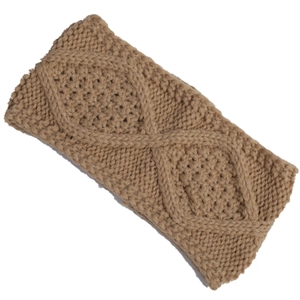 Close-up of khaki knitted headband showing detailed aran cable and diamond stitch textures