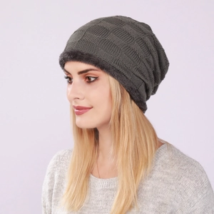 Detail view of winter knitted beanie featuring fleece lining and textured grid pattern