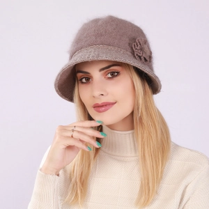 Close-up of winter knit cloche hat featuring fuzzy texture and side flower ornament