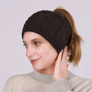 Detail of dark brown cable knit headband with ponytail opening for winter warmth