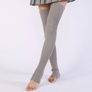 Close-up of grey ribbed knit over-knee leg warmers with stirrup design for yoga