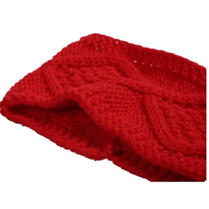 Detail showing the thick red knit headband with classic chunky cable twist texture