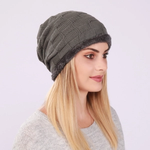 Detail of grey checkered knit beanie with warm fleece lining and ear protection