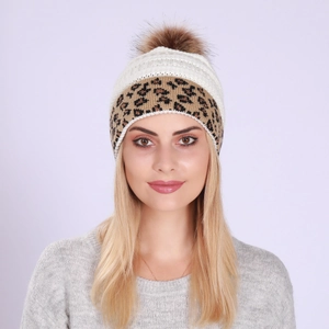 Close-up of winter knit beanie showing beige texture and leopard print rolled edge
