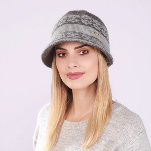 Detail of grey knitted winter hat featuring Nordic pattern and gold bee metal charm