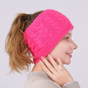 Detail of rose pink cable knit ear warmer headband with ponytail hole for women