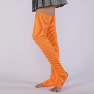 Detail of bright orange ribbed knit over-knee leg warmers with stirrup heel design