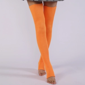 Detail of bright orange ribbed knit over-knee leg warmers with elastic stirrup design