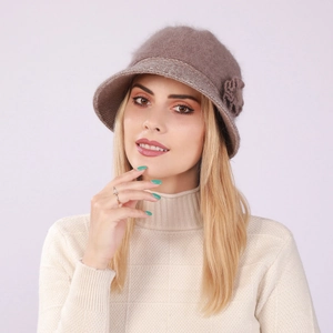 Close-up of winter knit cloche hat with floral detail and soft rabbit fur texture