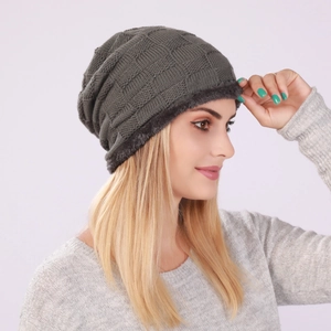 Detail of winter knit beanie showing textured grid pattern and thick fleece lining