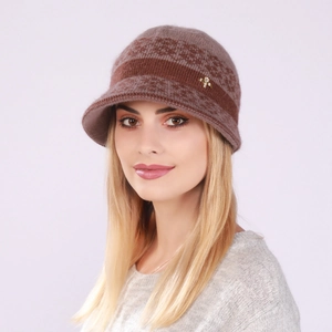 Close-up of knit winter bucket hat with warm wool texture and gold bee ornament